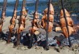 salmon baked on open fire pit